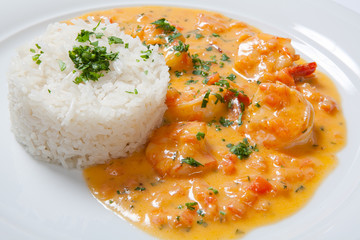 souse shrimp with greens and rice on a white background