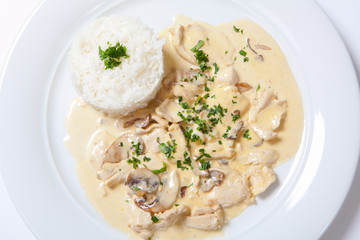 stewed chicken with white rice and mashroom sauce