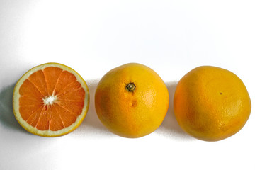 Closeup of yellow grapefruits on a white background