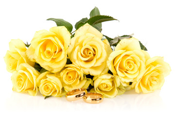 Wedding rings with bunch of roses, isolated