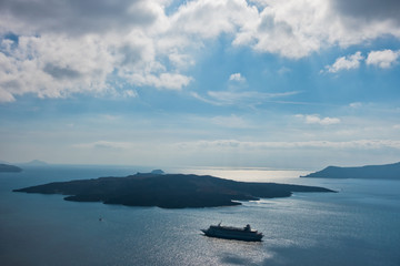 Fototapeta na wymiar Volcano island with cruisers anchored around at Santorini, Greece