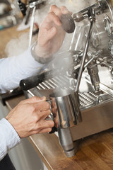 barista steaming milk