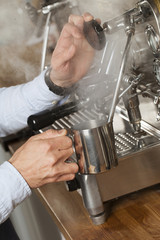 barista steaming milk