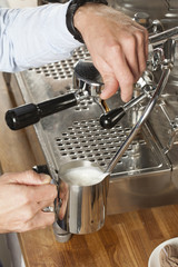 barista steaming milk
