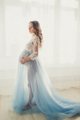 Pregnant pretty girl is wearing fashion lingerie
