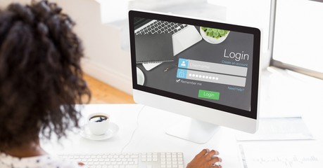 Businesswoman using log in page on computer