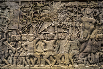 Fototapeta na wymiar Carved stone relief at Angkor Wat, Cambodia