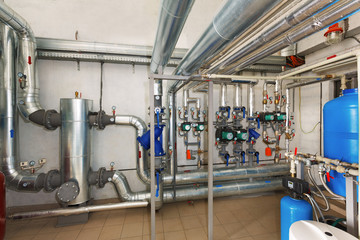 Modern pumping station with water treatment system in industrial gas boiler house