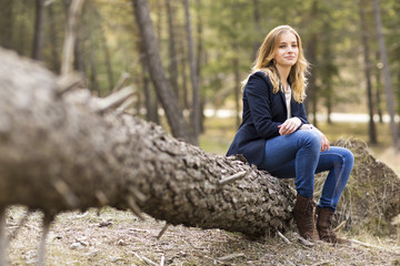 Image of pretty businesswoman looking at camera on natural space