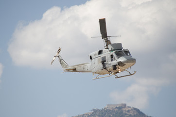 Helicopter bell uh 1 approach landing right machine gun view. Exhaust gases