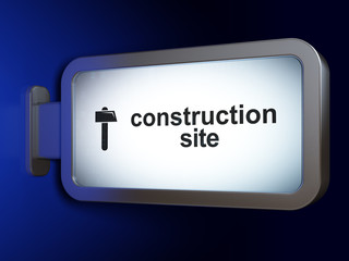 Construction concept: Construction Site and Hammer on billboard background