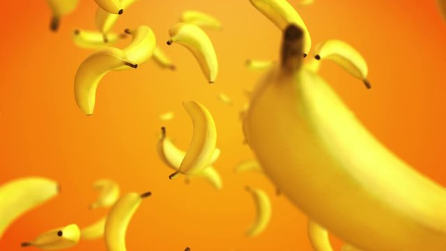 CGI 3D animation of yellow bananas floating against orange background 