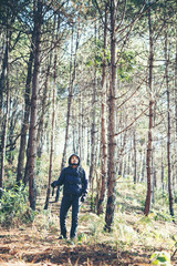 Fototapeta na wymiar Men travel in pine forest.