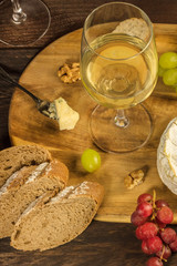 Wine and cheese tasting, with bread and grapes
