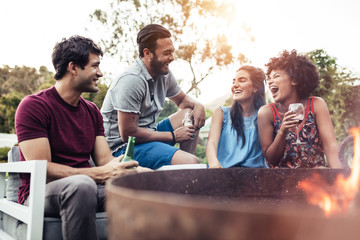 Young people having a party in backyard.