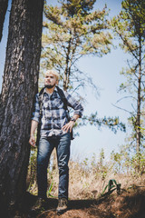 Young man hiking standing relax and admire nature.