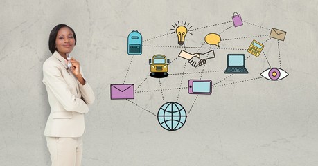 Businesswoman standing by various icons on beige background