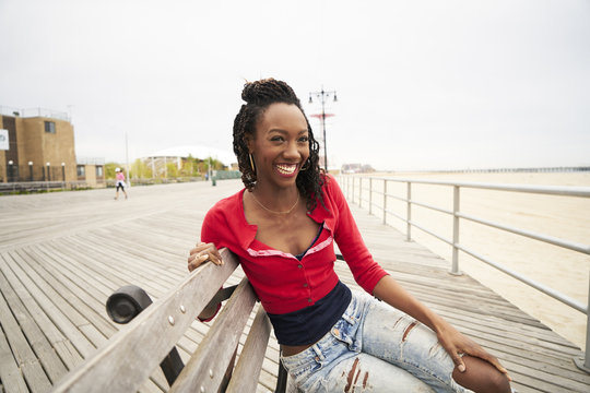 Smiling woman sitting on bench