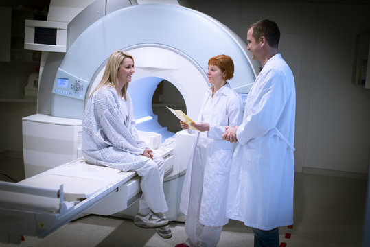 Doctors discussing MRT result with patient