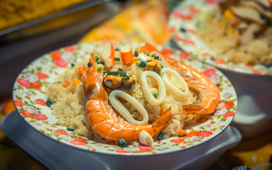 Rice with seafood. Night food market, Thailand.