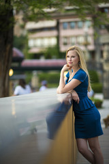 Portrait of a young beautiful blonde woman in a urban background