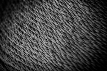 reel black synthetic thread. textile concept. abstract background