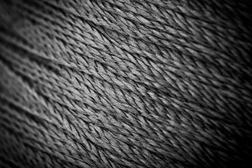 reel black synthetic thread. textile concept. abstract background