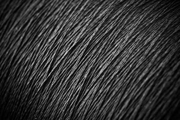 reel black synthetic thread. textile concept. abstract background