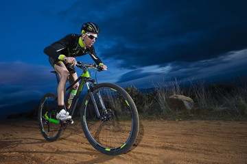 Fototapeta premium Cyclist man riding mountain bike on mountain.