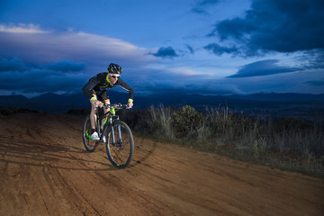 Fototapeta na wymiar Cyclist man riding mountain bike on mountain.