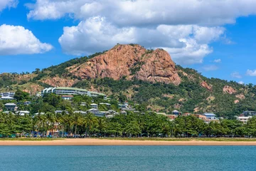 Afwasbaar Fotobehang Heuvel A view from the water of Castle Hill in the center of Townsville, Queensland, Australia
