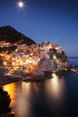 Fototapeta na wymiar travel amazing Italy series - scenic night view of colorful village Manarola, Cinque Terre