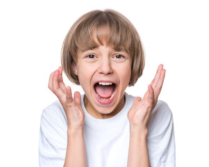 Close-up emotional portrait of caucasian girl crying painfully and screaming. Funny cute child in white blank t-shirt looking at camera, isolated on white background.