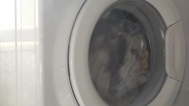 Washing machine with front loader doing laundry