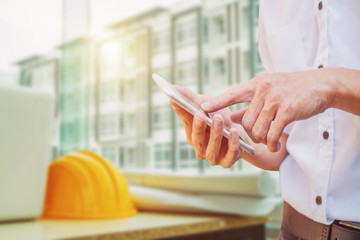 Obraz premium mobile concept.Business man hands holding touch screen smartphone 