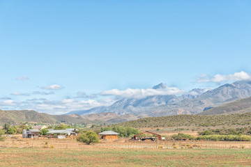 Fototapeta premium Farm landscape with the Swartberg in the back near Hoeko