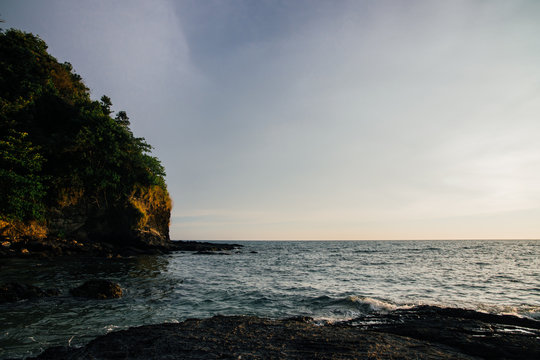 precipice is a sea view. Storm sky, power. Stones in the sea.