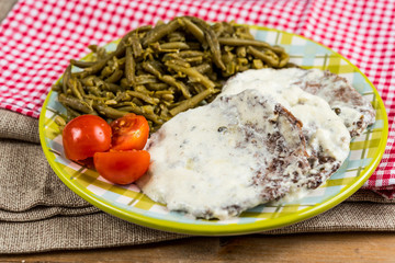 juicy steak veal beef meat with tomato and vegetables
