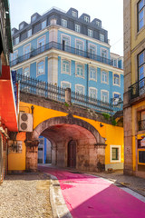 The famous pedestrian Pink street of Rua Nova do Carvalho in the Cais do Sodre area of Lisbon, Portugal © Kavalenkava