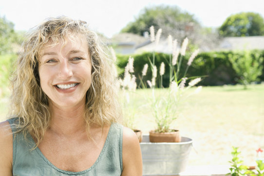 Portrait of smiling Caucasian woman in garden
