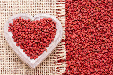 Seeds of achiote, originating from central america and parts of south america is used to season and color food