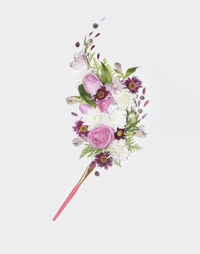 Pink floral bouquet and brush