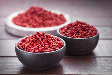 Seeds of achiote, originating from central america and parts of south america is used to season and color food