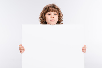 Boy holding white blank board