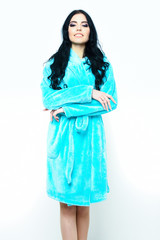 sexy smiling girl posing in turquoise velour bathrobe