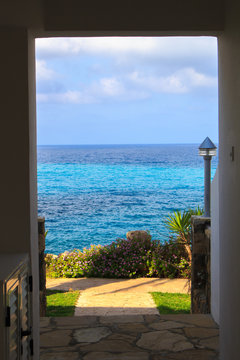 View Of The Sea Through The Passage On A Sunny Day.