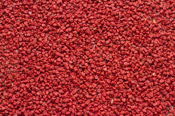 Seeds of achiote, originating from central america and parts of south america is used to season and color food