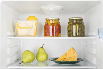 Open fridge full of fresh fruits and vegetables © shkliarov