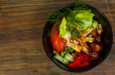 Teriyaki Chicken salad on a wooden background. with copy space. top view