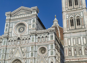 Fototapeta premium Detail of the facade of the famous Cathedral of Santa Maria del Fiore, Duomo of Florence, Italy, on a sunny day